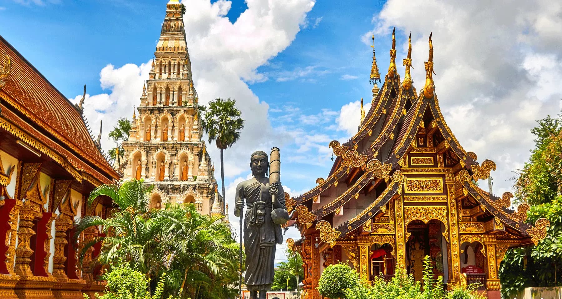 Golden sunset silhouettes of Buddhist temples in Bangkok