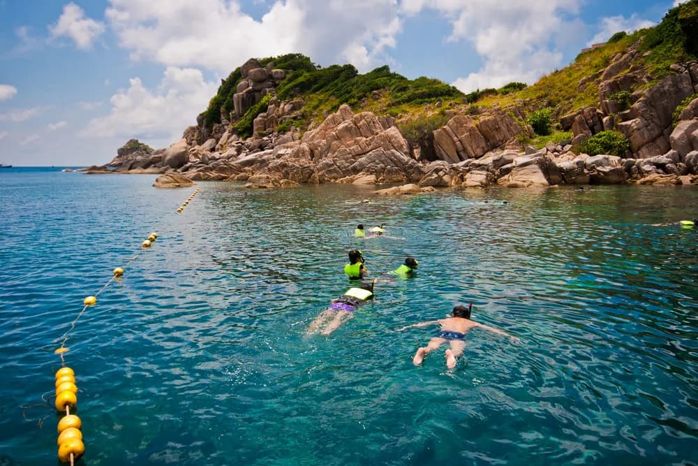 Person kayaking in clear tropical water: the outdoor life of Koh Samui