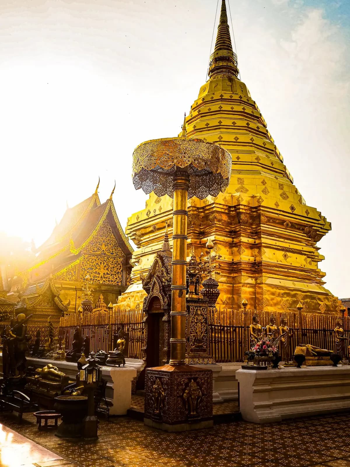 Doi Suthep temple golden chedi at sunrise above Chiang Mai