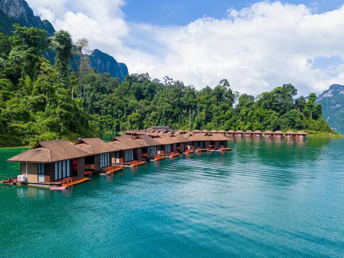 Floating bungalow on a jungle lake surrounded by limestone karst towers