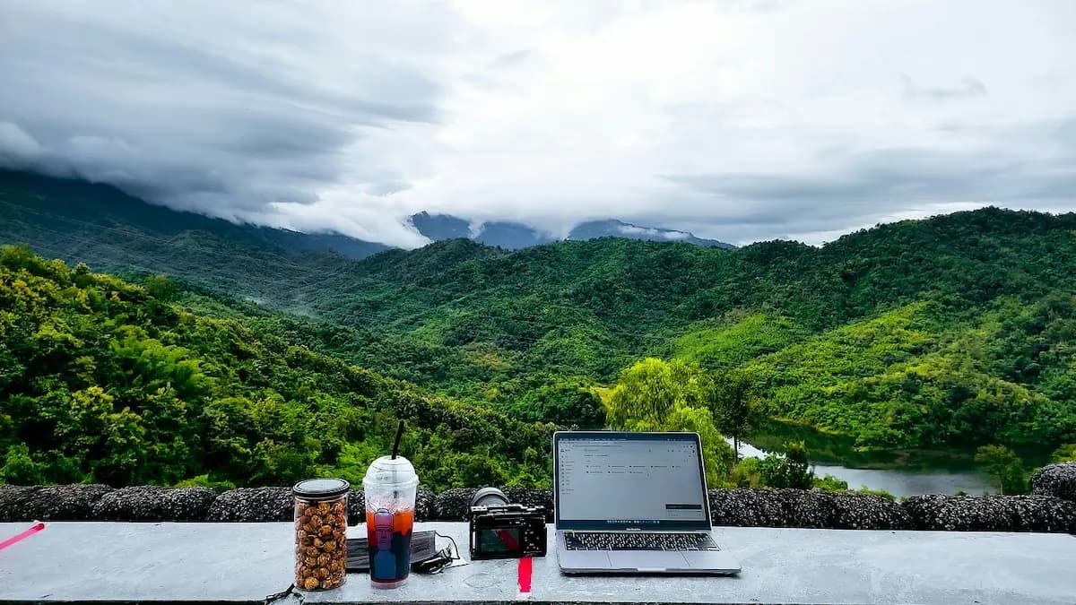 Person working from a cafe with good natural light: remote work in Hua Hin